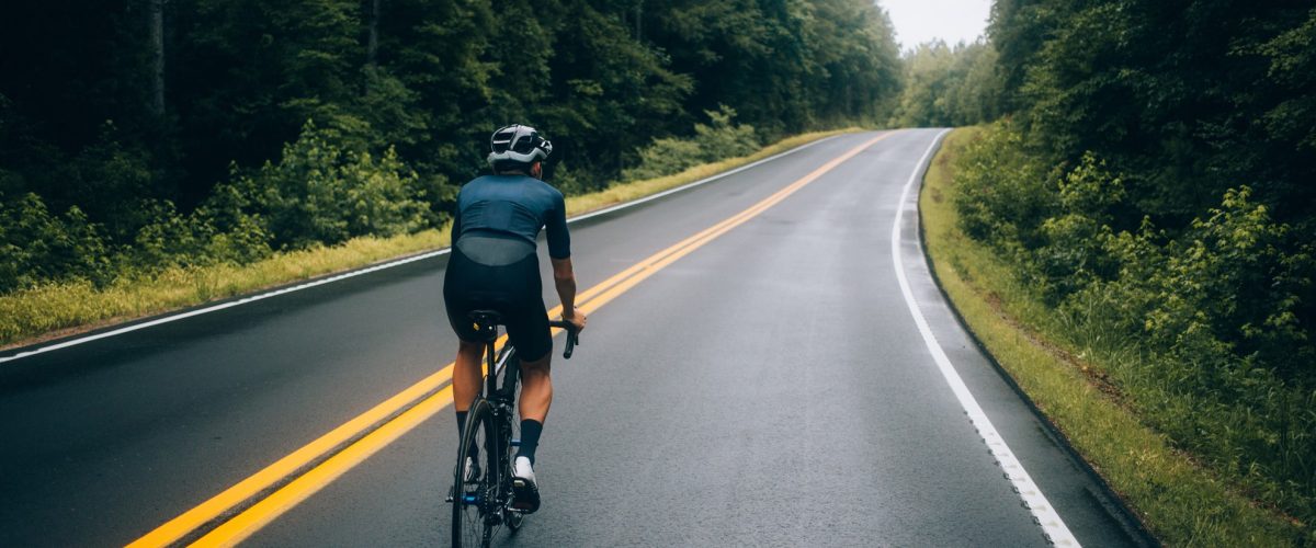 cyclist-man-riding-bike-road